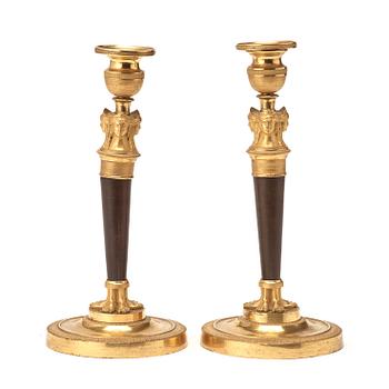 A pair of French Empire early 19th century candlesticks.