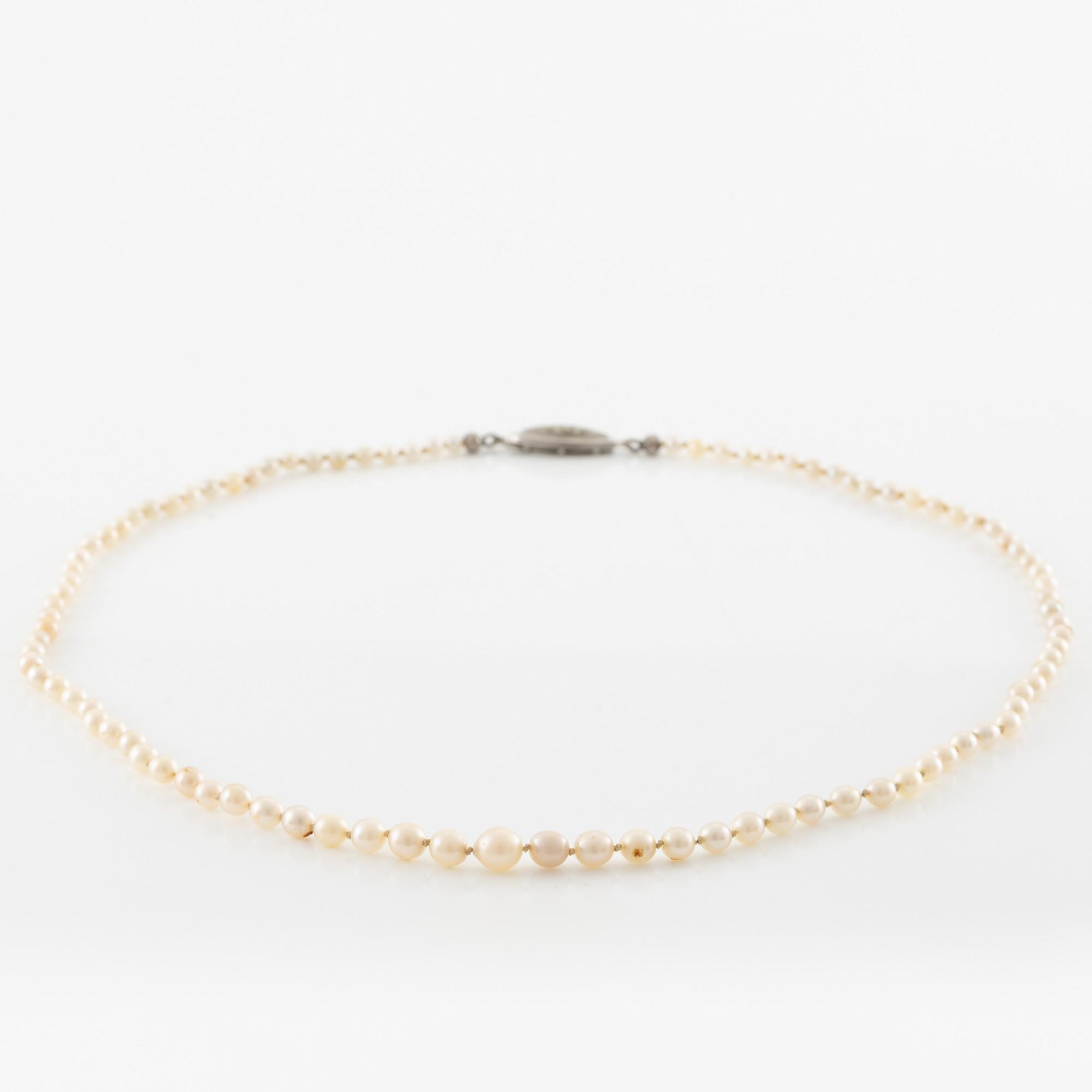 Pearl necklace, graduated pearls, clasp silver with pyrite.