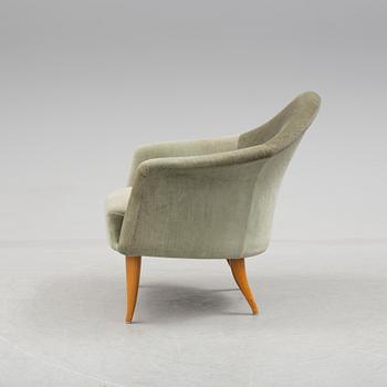 A easy chair "Lilla Adam" by Kerstin Hörlin-Holmquist.