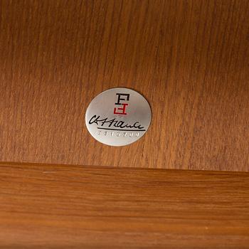 GRETE JALK, a teak coffee table fron France, Denmark, 1963.