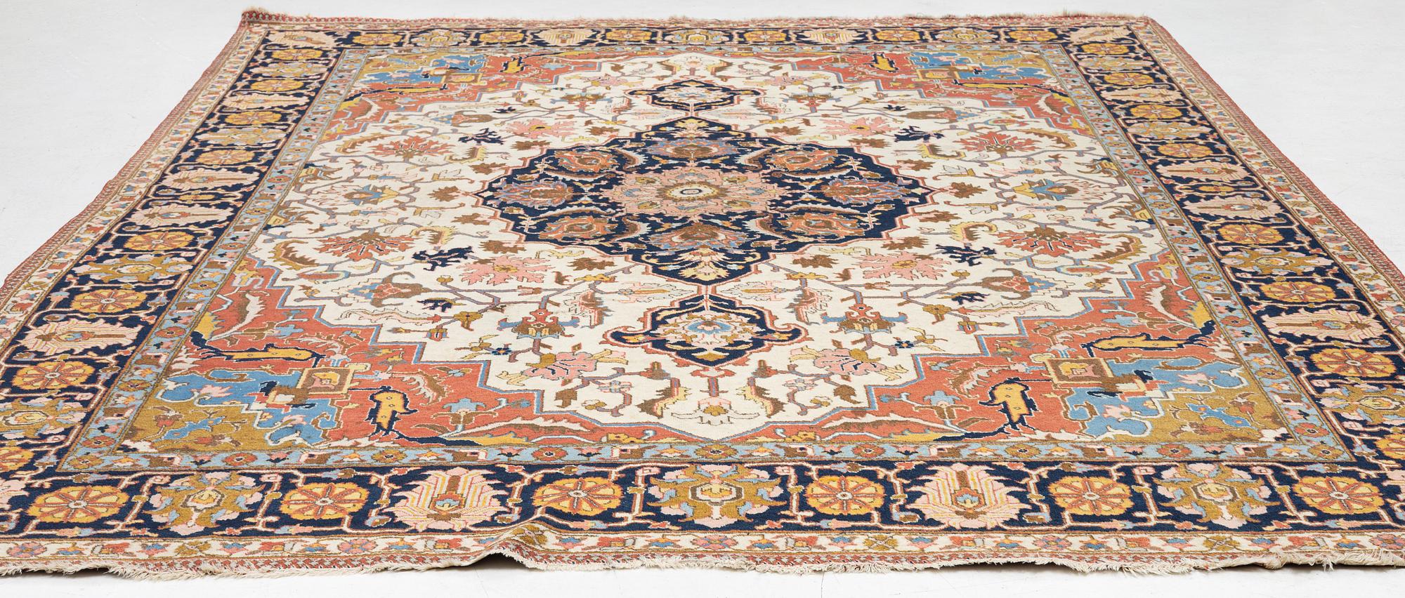 An antique Tabriz carpet, c. 365 x 280 cm.