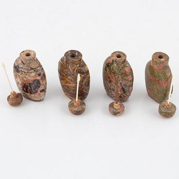 Nine Chinese snuff bottles in mottled stone, 20th century.