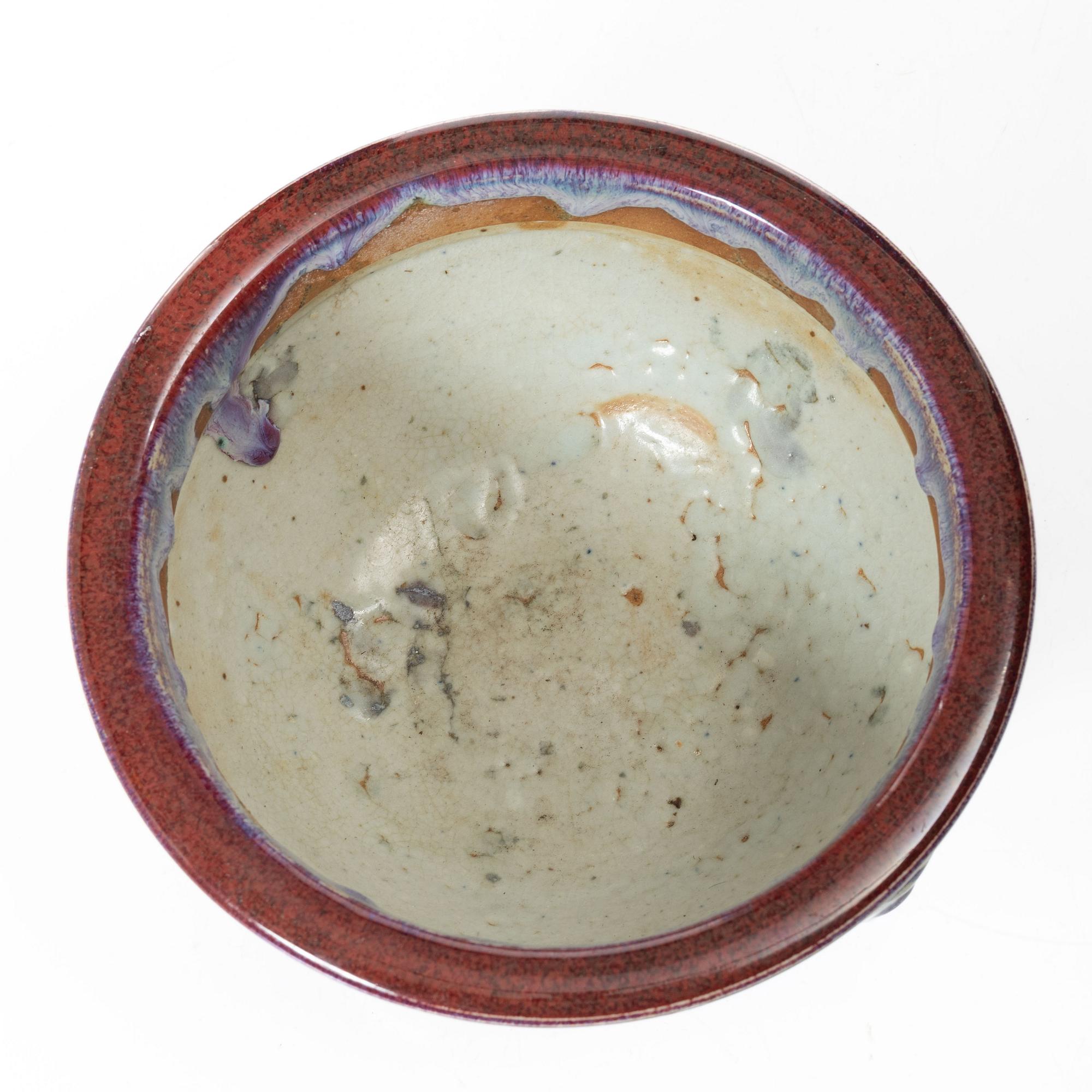 A Chinese sang de boeuf stoneware bowl / flowerpot, 20th century.