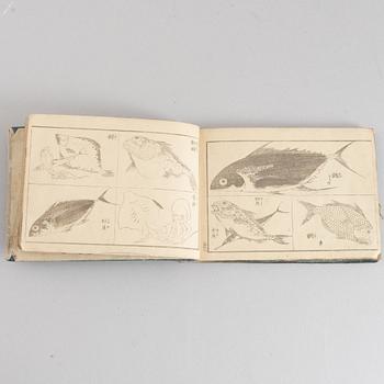 A group of five Japanese albums, including Katsushika Isai and Utagawa Kunisada, Meiji (1868-1912).