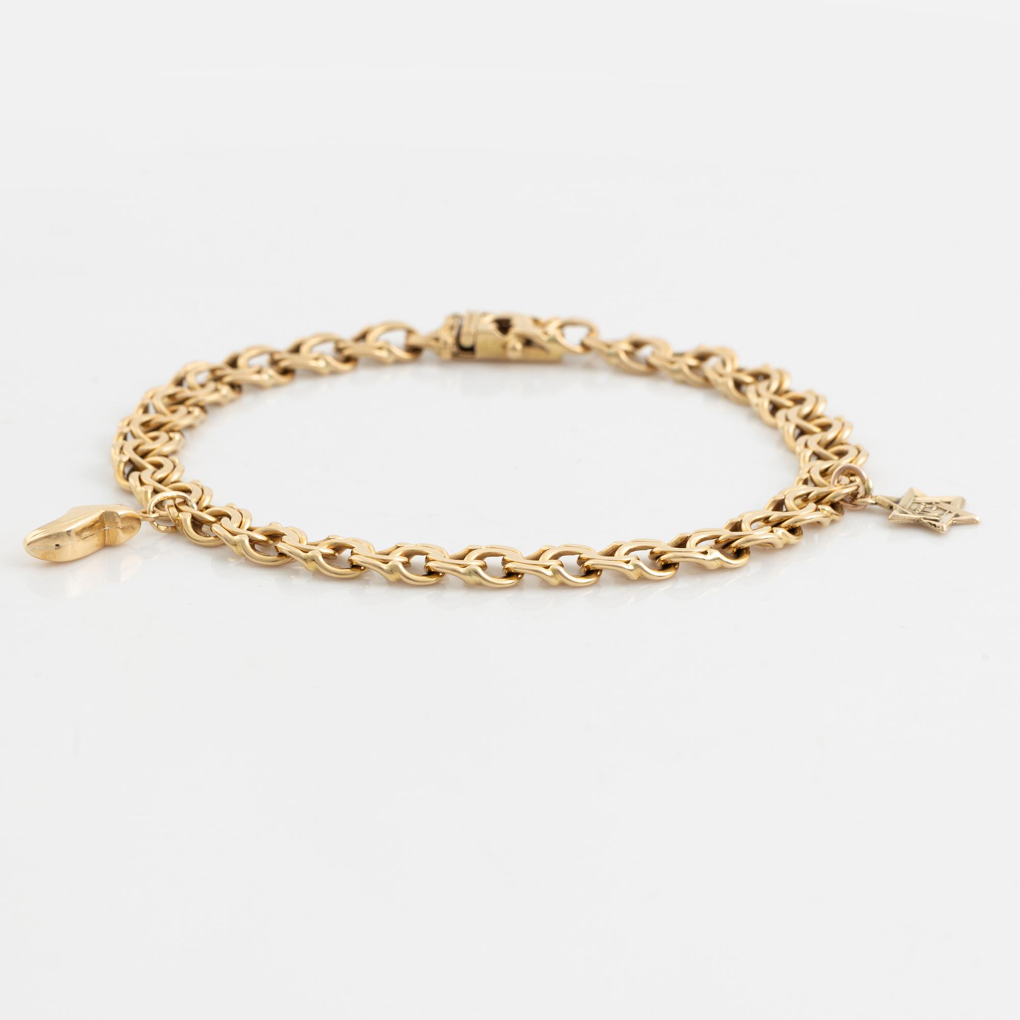 Armband 18K guld, bismarck, med två berlocker 14K guld.