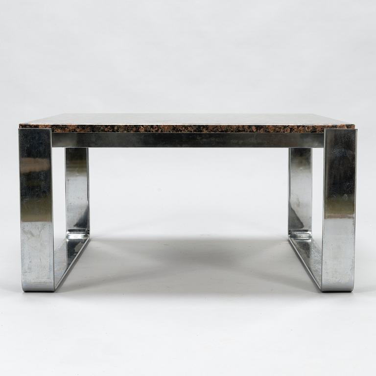 A chromed steel and polished granite coffee table, latter half of the 20th century.