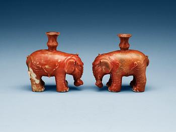 1447. A matched pair of elephant candle holders, Qing dynasty.