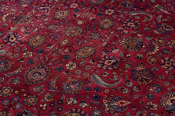 A semi-antique Mashad carpet of Shah Abbas design, c 516 x 360 cm.