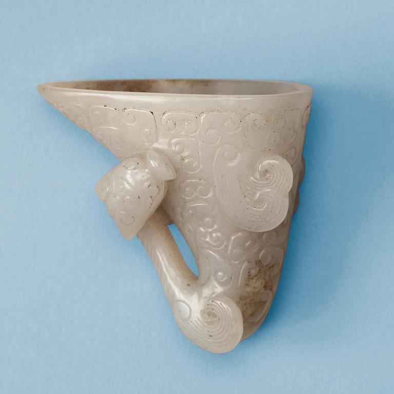 A carved white nephrite libation cup, China.