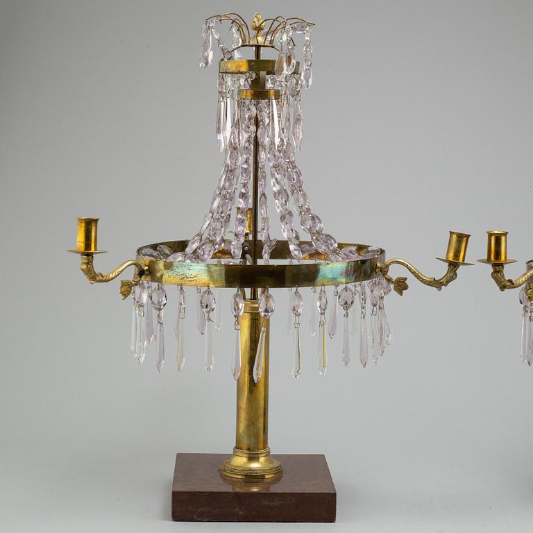 A pair of late Gustavian style three-light candelabra.