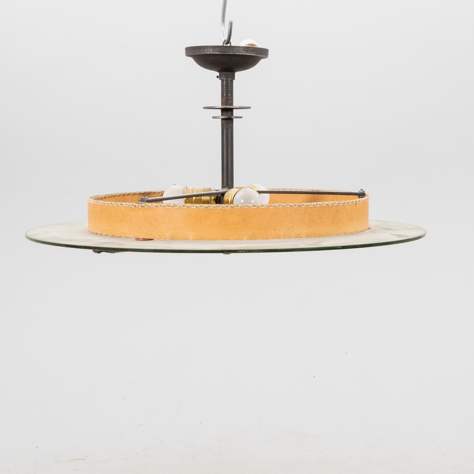 A 1930s glass ceiling pendant.