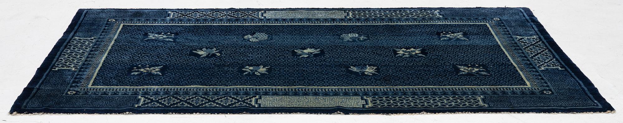An antique Baotou carpet, north China, c. 257 x 155 cm.