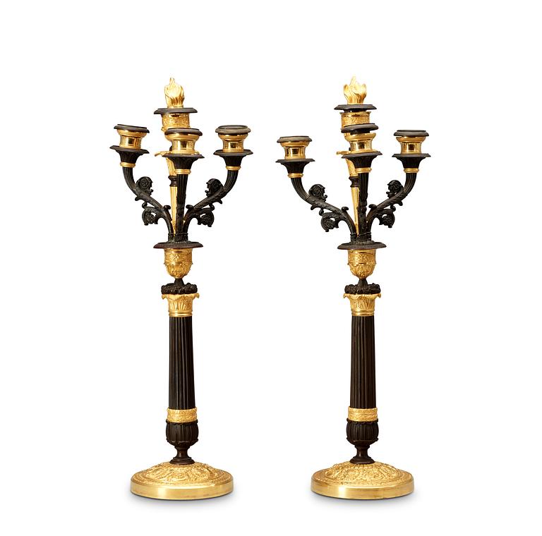 A pair of French Empire 19th century four-light candelabra.