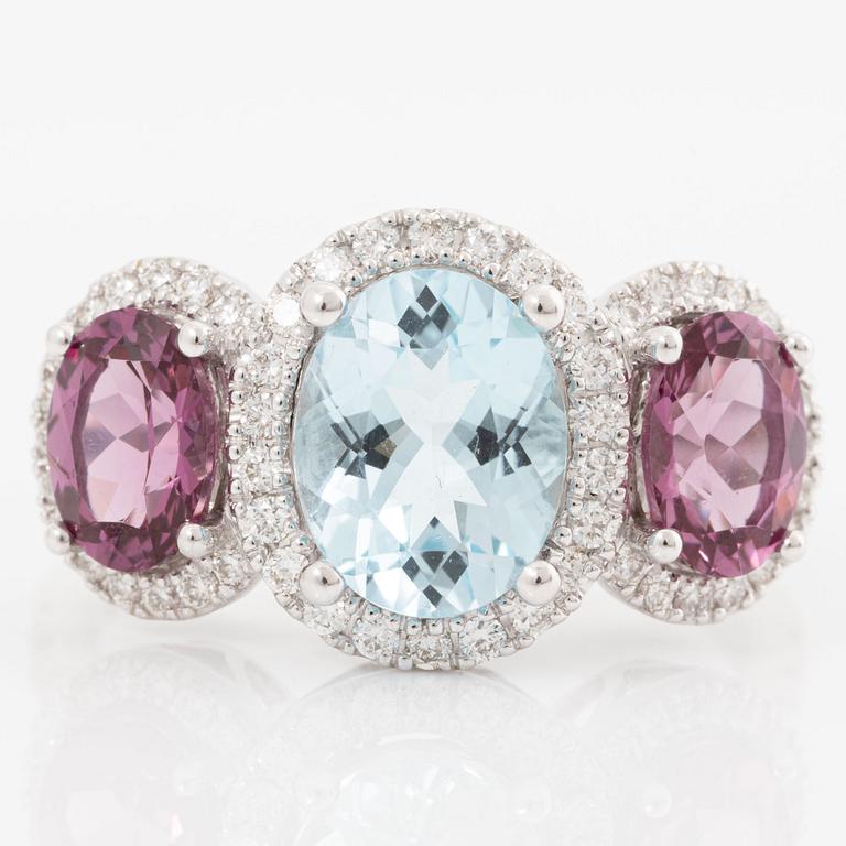 Ring in 18K white gold with blue topaz, rhodolite garnet, and brilliant-cut diamonds.