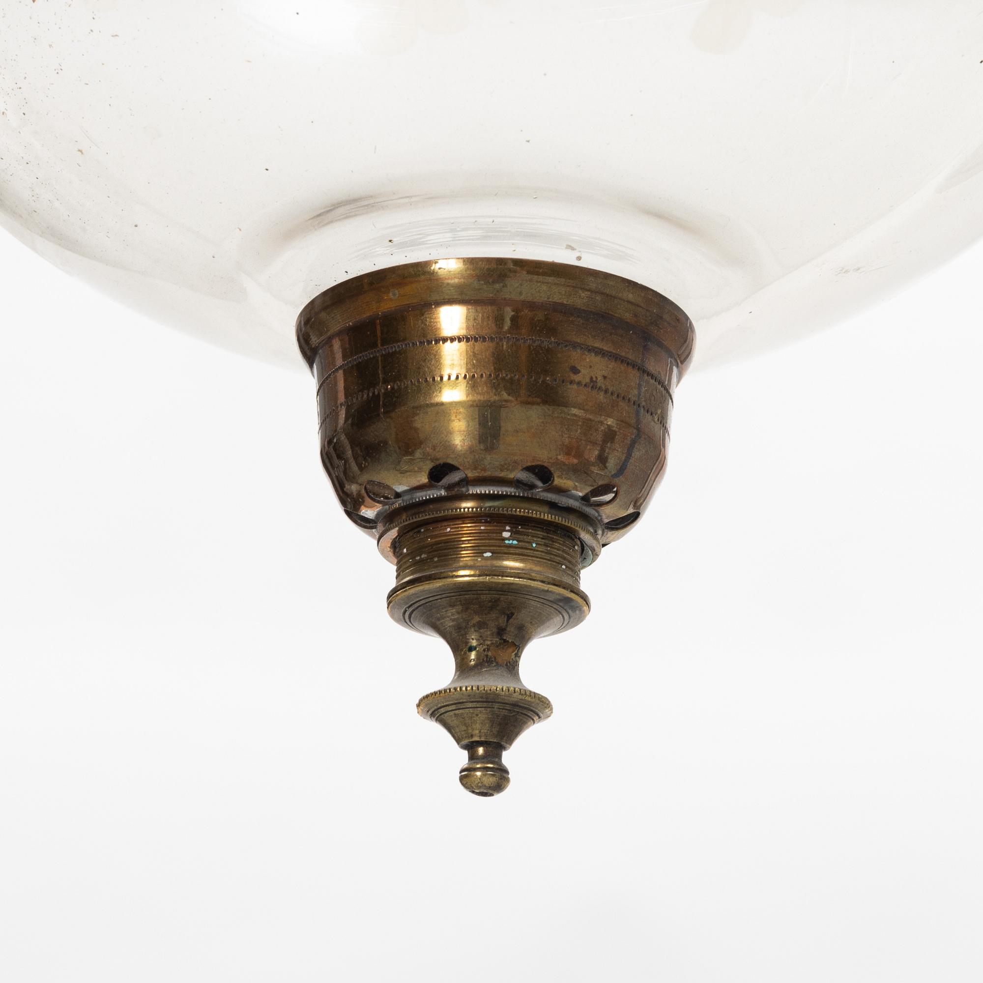 A glass and metal lantern, early 20th century.