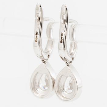 Earrings, a pair, 18K white gold set with pear-shaped and brilliant-cut diamonds.
