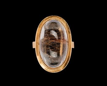 659. RING, cabochon cut rutile quartz.