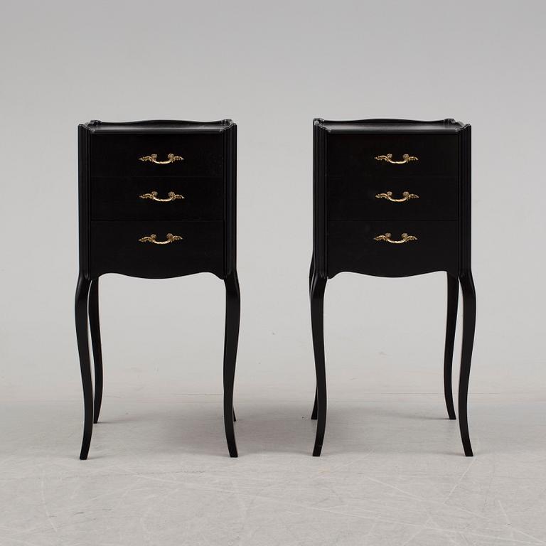 A pair of rococo style bedside tables, 20th century.