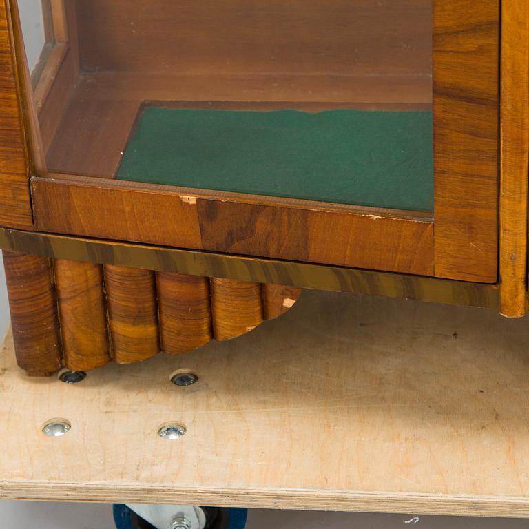 A 1940s display cabinet, England.