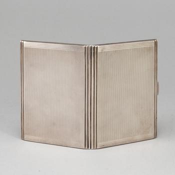 A sterling silver cigarette-case, made in 1935 by Dingley (or Davies) Brothers, Birmingham, England.
