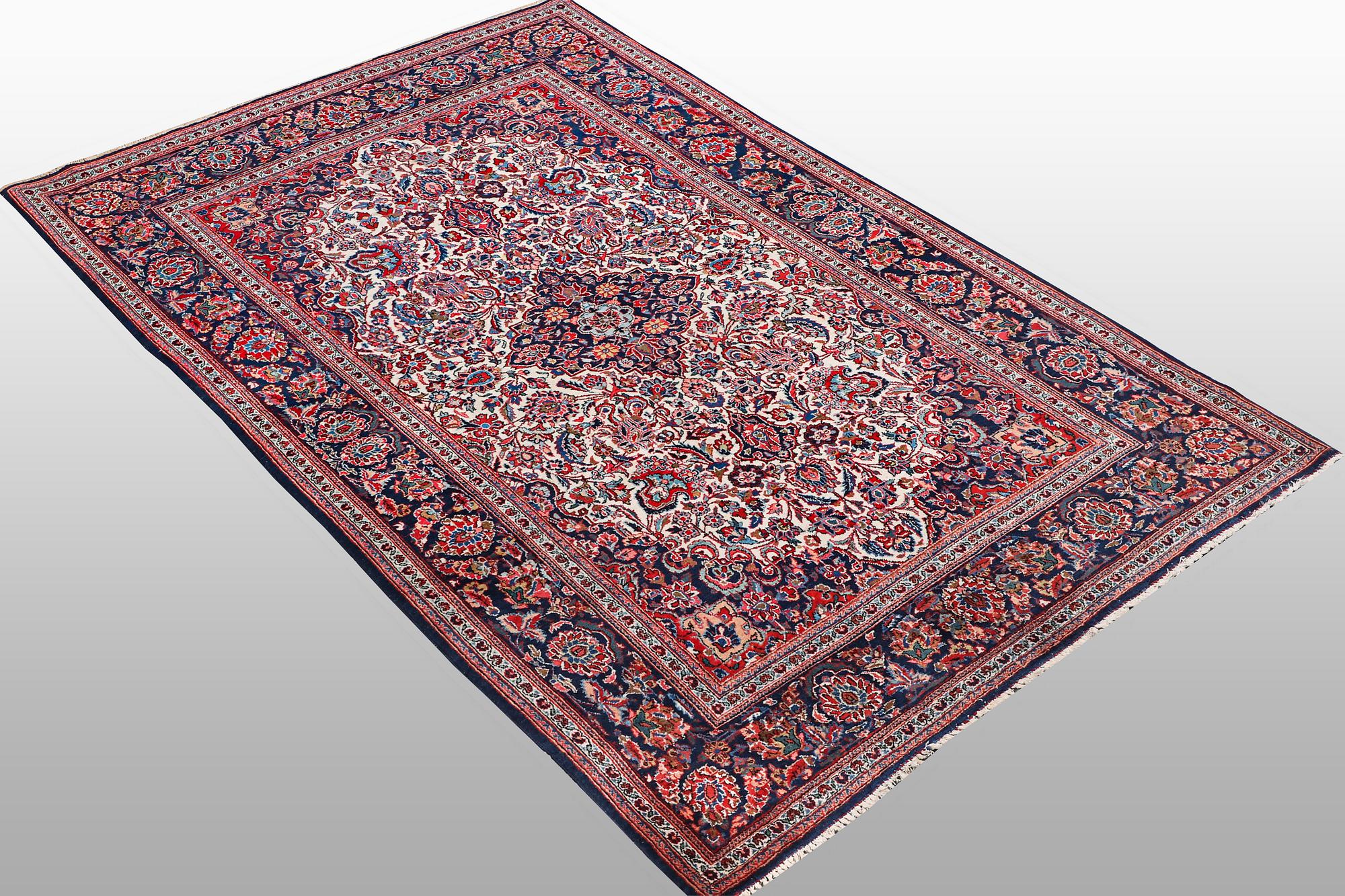 A rug, semi-antique Keshan, 217 x 134 cm.