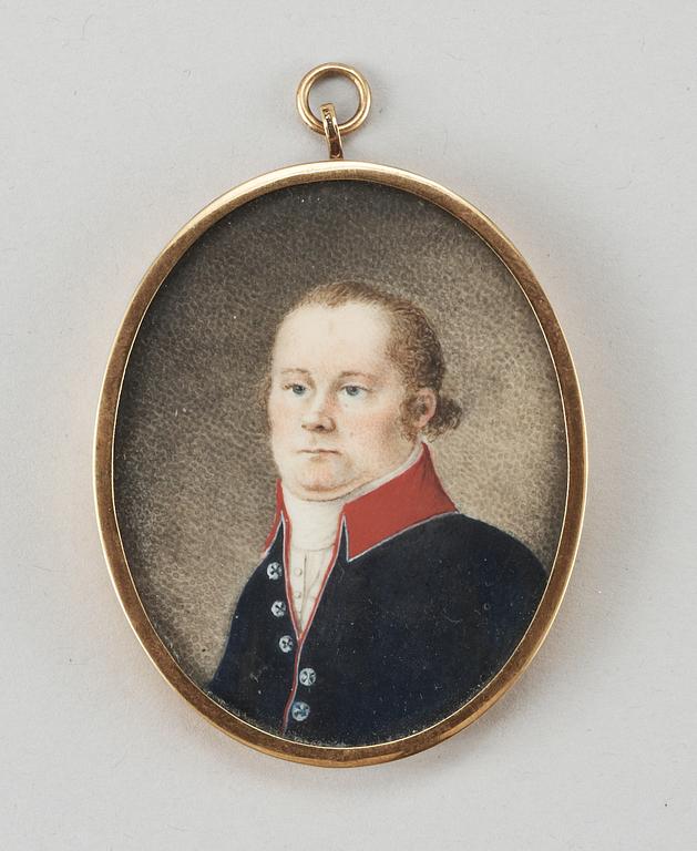 A miniature portrait of a gentlemen from the early 19th century.