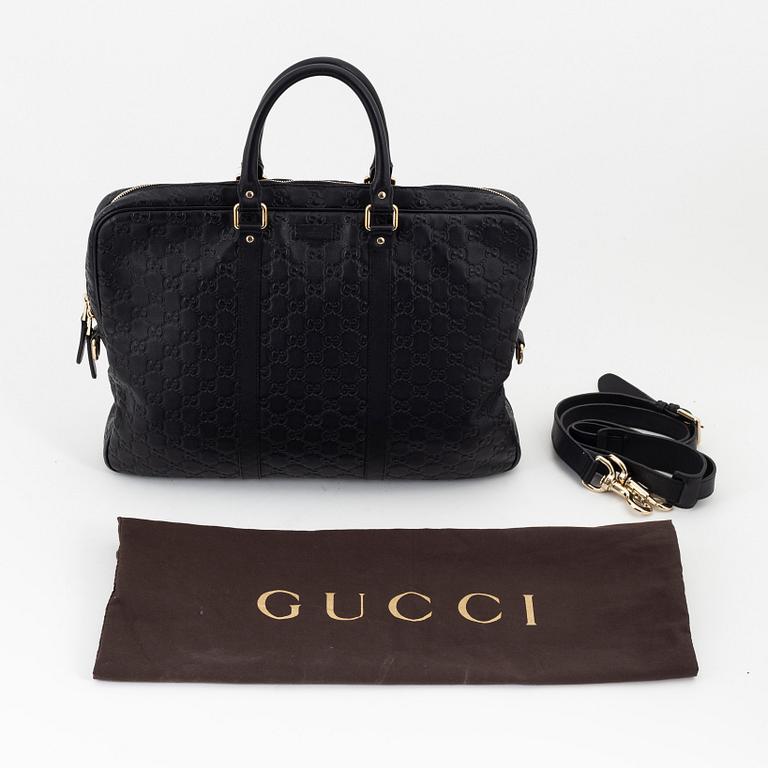 Gucci, a briefcase.