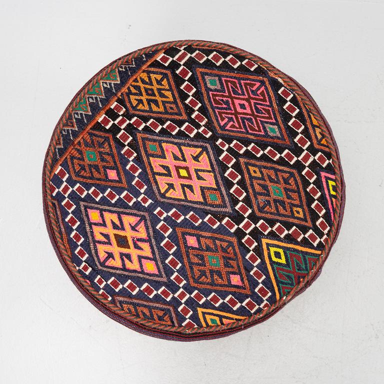 A Kelim covered stool.