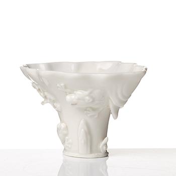 A blanc de chine rhinoserous libation cup, Qing dynasty, Kangxi (1662-1722).