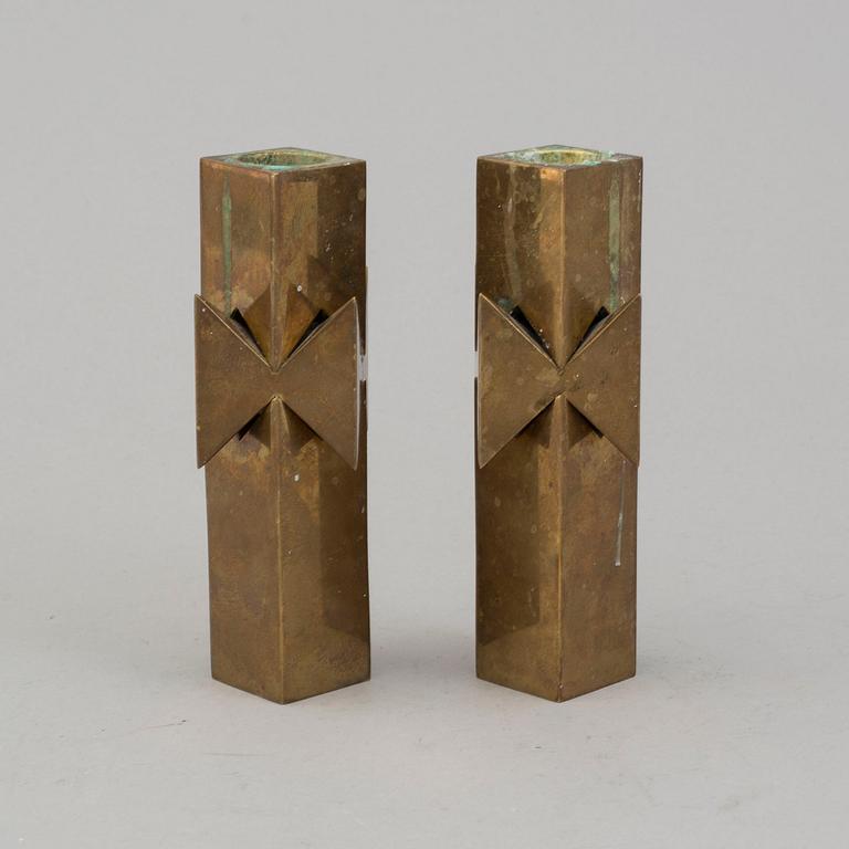 A pair of brass candlesticks by Pierre Forssell for Skultuna.