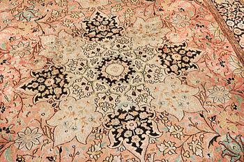 A silk Kashmar carpet, c. 280 x 177 cm.