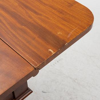 A Swedish Empire twin flap-top mahogany table, first part 19th Century.