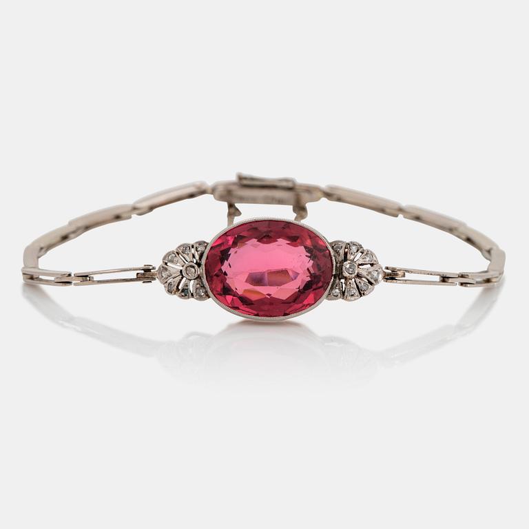 An 18K gold bracelet set with a faceted pink tourmaline weight ca 6.00 cts.