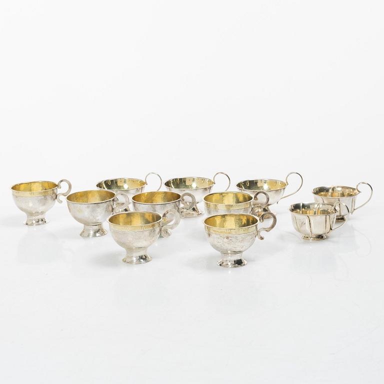 A set of eleven silver punch mugs, including with mark of Nya Guldsmedsaffären Göte Persson, Vilhelmina 1951.