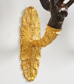 A pair of French Empire five-branch gilt and patinated bronze appliques, first part 19th century.