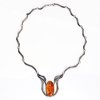 A silver and amber necklace.