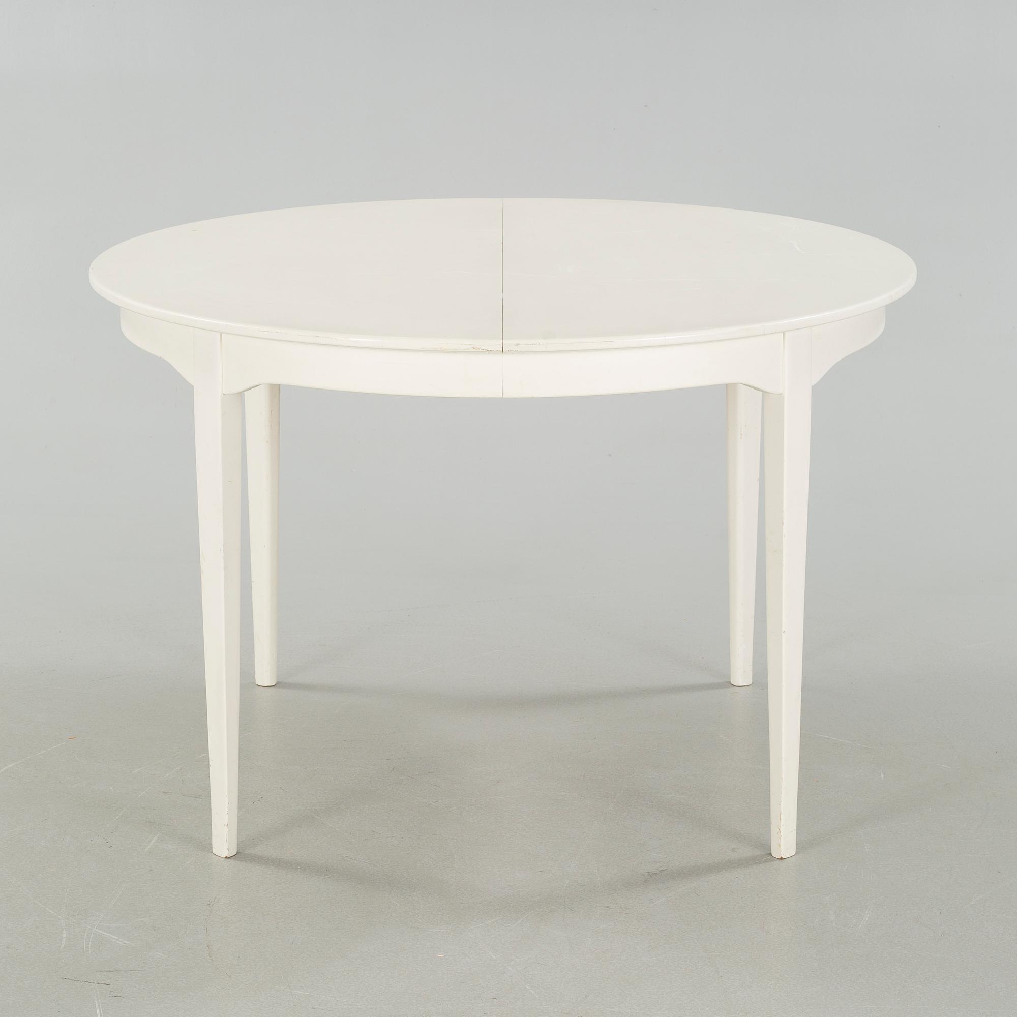 A dining table and six chairs, chairs by Carl Malmsten, model "Herrgården", second half of the 20th century.