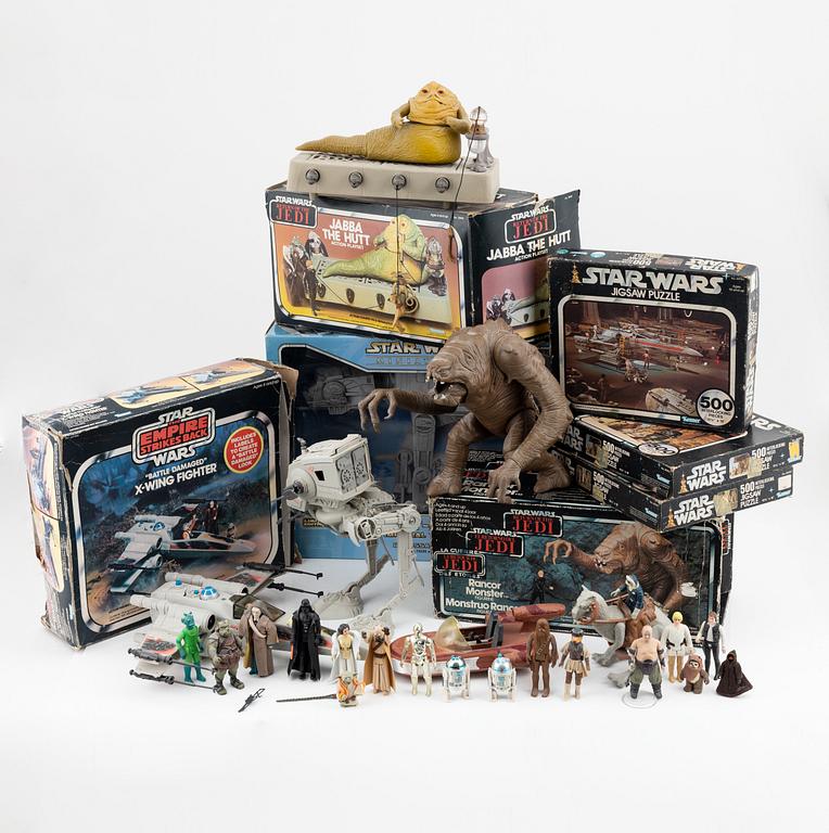 Star Wars, a set of 23 action figures and vehicles, 1970's/80's.