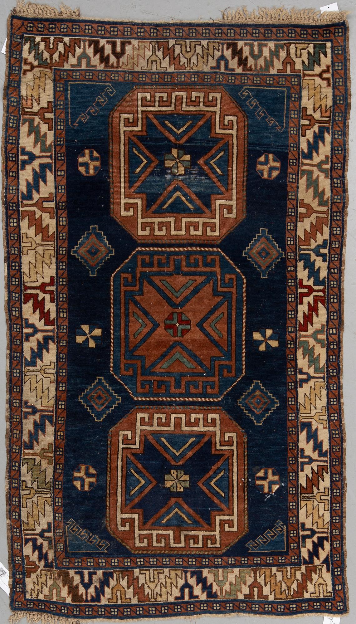 A RUG, a semi-antique Caucasian, ca 175 x 102 cm.