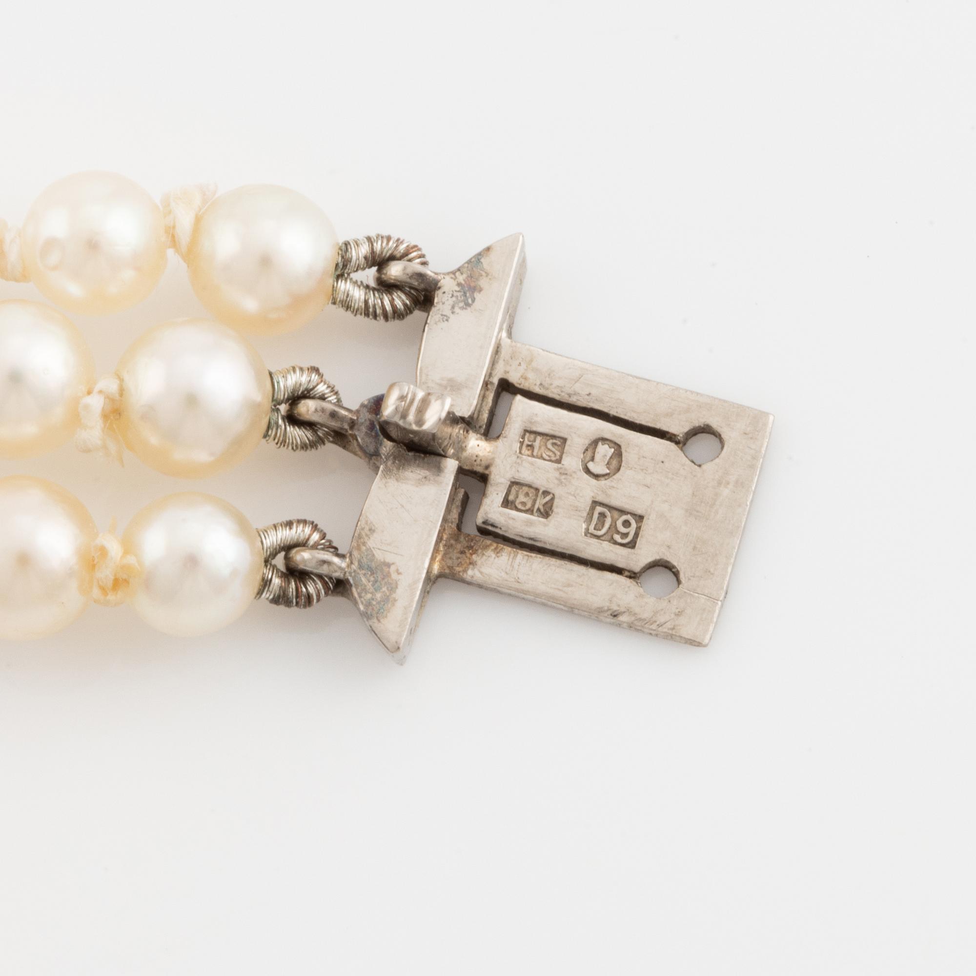 Three strand calibrated cultured pearl necklace, clasp with pearl and rose cut diamonds.