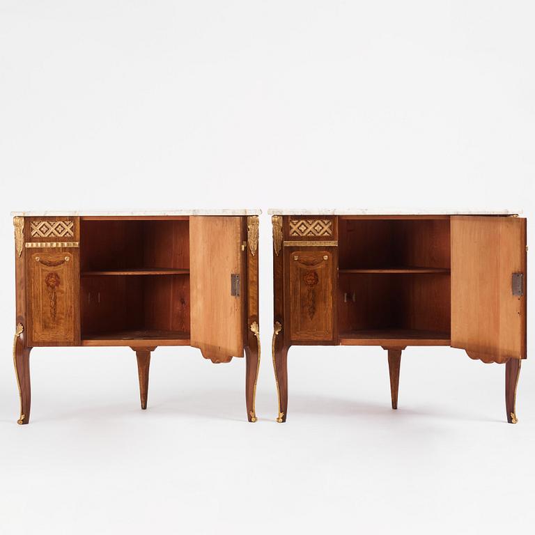 A pair of Gustavian marquetry, ormolu-mounted, and marble encoignures by G. Iwersson (master in Stockholm 1778-1813).