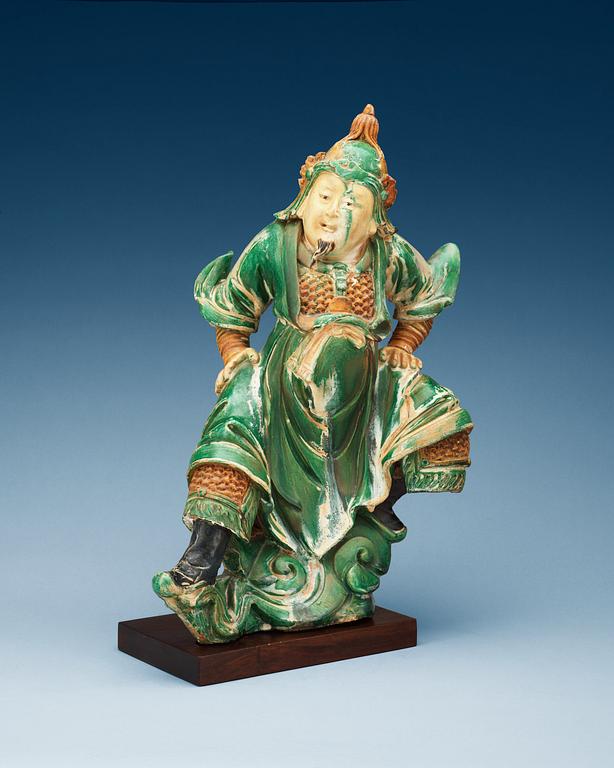 A gren and yellow glazed roof tile figure, Ming dynasty.