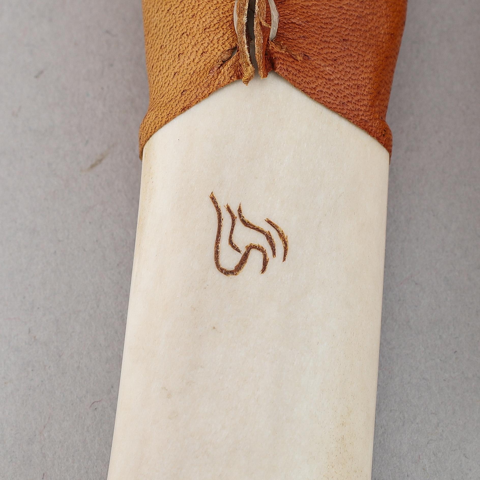 Lennart Sammelin, a reindeer horn, birch and leather Sami knife, signed LS.
