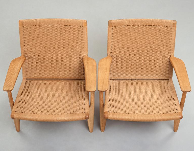 Hans J. Wegner, a pair of oak "CH-25" armchairs, Carl Hansen & Son, Denmark.