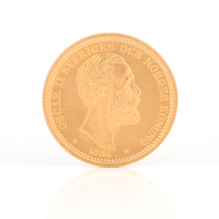 GULDMYNT, 20 kronor, Oscar II av Sverige och Norge 1884. Vikt ca 9 gram.