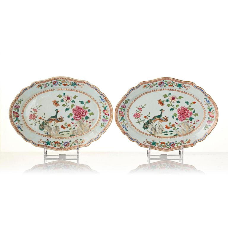 A group of famille rose 'double peacock' serving dishes, Qing dynasty, Qianlong (1736-95). (8 pieces).
