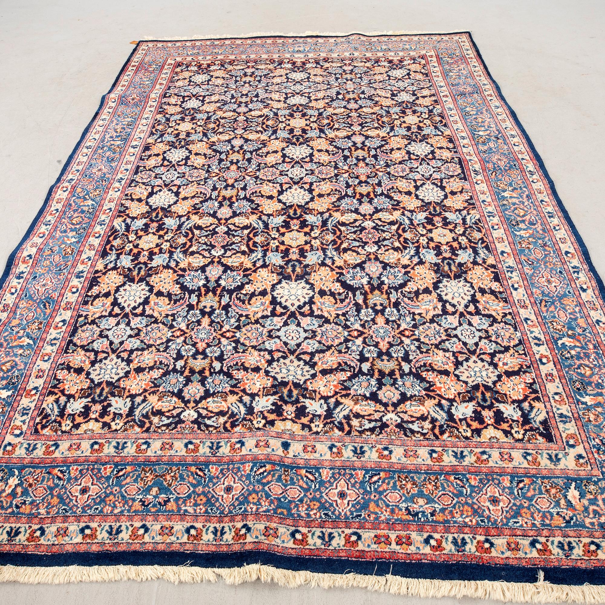 A semiantique Mashad carpet approx 320x220 cm.