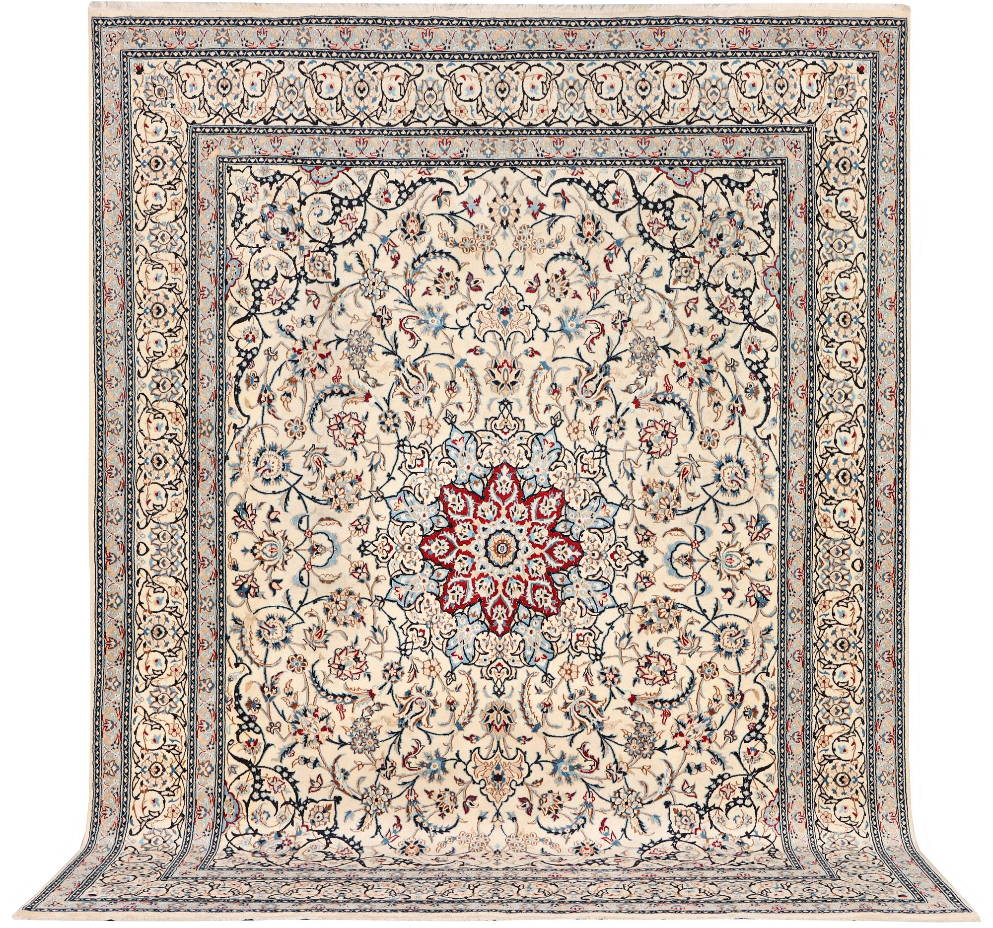 A Nain carpet, part silk, 9 laa, c. 390 x 295 cm.