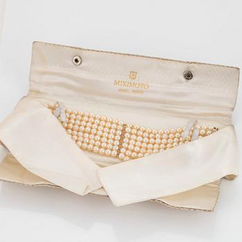 A seven strand cultured pearl Mikimoto bracelet.