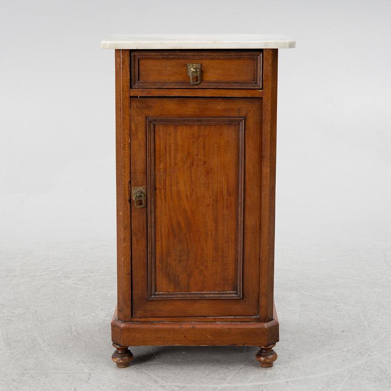 A bedside table, circa 1900.